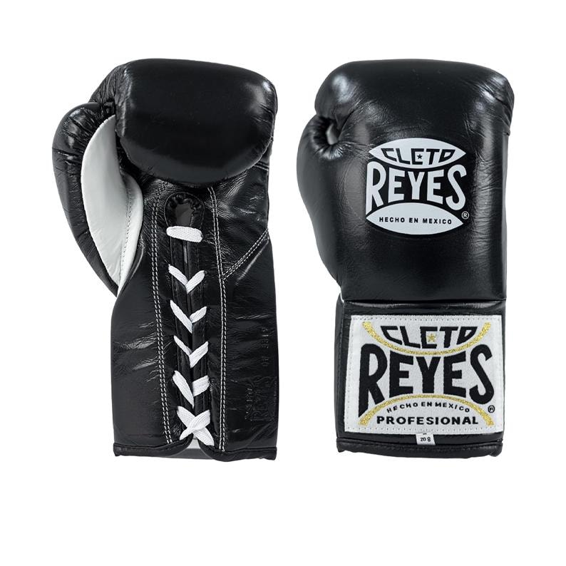 May include: Pair of black leather boxing gloves with white laces and accents. The gloves feature the "CLETO REYES" logo in white and gold. "HECHO EN MEXICO" is printed on the gloves.
