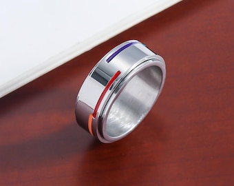 Anillo giratorio arcoíris minimalista: anillo de titanio con sutiles rayas de orgullo, joya LGBTQ+ para aliviar la ansiedad, ideal para uso diario.