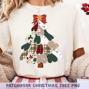 May include: Cream-colored t-shirt featuring a patchwork Christmas tree design. The tree is composed of various fabric patterns, including plaid, polka dots, and floral prints, in shades of green, red, and beige. A red bow and gold star adorn the top. The text "PATCHWORK CHRISTMAS TREE PNG" is at the bottom.