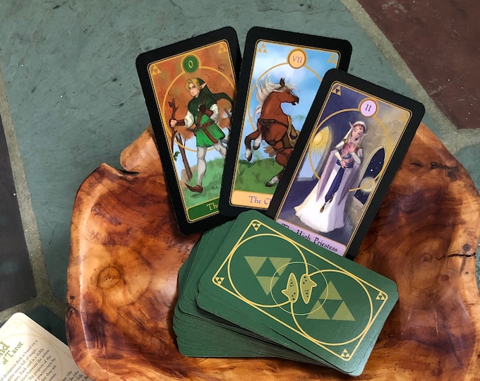 A tarot card featuring a squirrel surrounded by autumn leaves, symbolizing preparation and abundance.