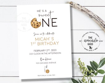 May include: A white invitation card with a brown and white cookie illustration. The text reads "He's a sweet one" with a large black "ONE" and "Join us to celebrate Micah's 1st Birthday". The date is February 2nd, 2023 at 3 o'clock in the afternoon. The location is "Our Home" at 123 Chicago Avenue. The RSVP information is "RSVP Emilia 123 456 7890".