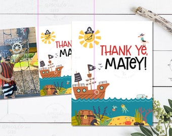May include: Thank you card with a pirate ship, a sun, and a seagull. The card says "Thank ye, Matey!" in red and black text.