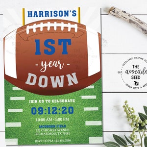 May include: A football-themed invitation for a 1st birthday party. The invitation features a brown football with white laces and a blue "1st" on a green field. The text reads "Harrison's 1st -year- Down" and "Join us to celebrate 09:12:20 10:00 AM - 1:00 PM Jacobsen Field 123 Chicago Avenue Richardson, TX 75081 RSVP to Pia 123.456.7890".