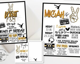 May include: A black and gold birthday sign with the name Micah and details about his second birthday. The sign includes his height, weight, favorite foods, favorite toys, and nicknames. The sign is decorated with a boombox, peace signs, and a basketball.