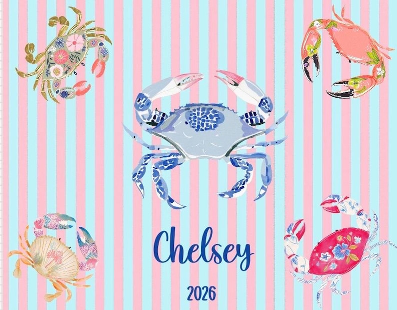 May include: A patterned design featuring five crabs in various colors and patterns, set against a background of pink and blue vertical stripes. The name "Chelsey" and the number "2026" are written in blue script.