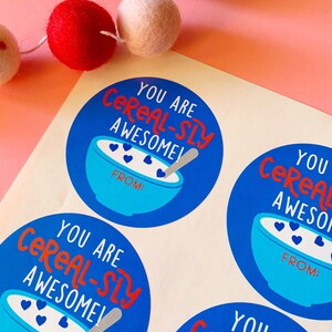 May include: Four blue and white round stickers with the text "You are cereal-sly awesome!" in red and white text. Each sticker has a bowl of cereal with blue hearts and a spoon. The text "From:" is printed below the bowl of cereal.