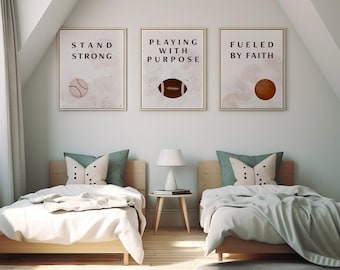 May include: Three framed prints with inspirational quotes and sports imagery. The prints feature the text "Stand Strong", "Playing with Purpose", and "Fueled by Faith". Each print has a different sport ball image: baseball, football, and basketball.