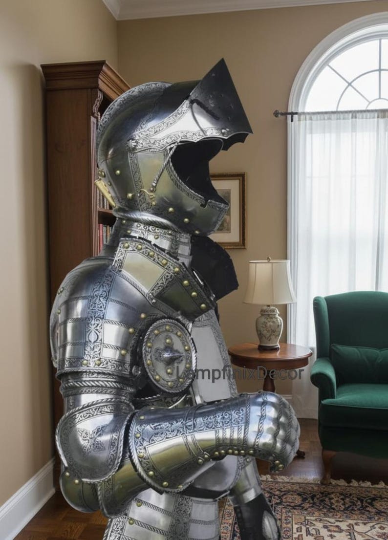 May include: A full suit of medieval armor, crafted from polished metal with intricate etched designs and brass accents. The helmet features a visor, and the armor includes articulated limbs and a chest plate. The armor is displayed indoors.
