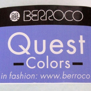May include: A blue and black label with white text that reads "Quest - Colors - first in fashion: www.berroco.com". The label also features a logo with a stylized wave design and the word "Berroco".