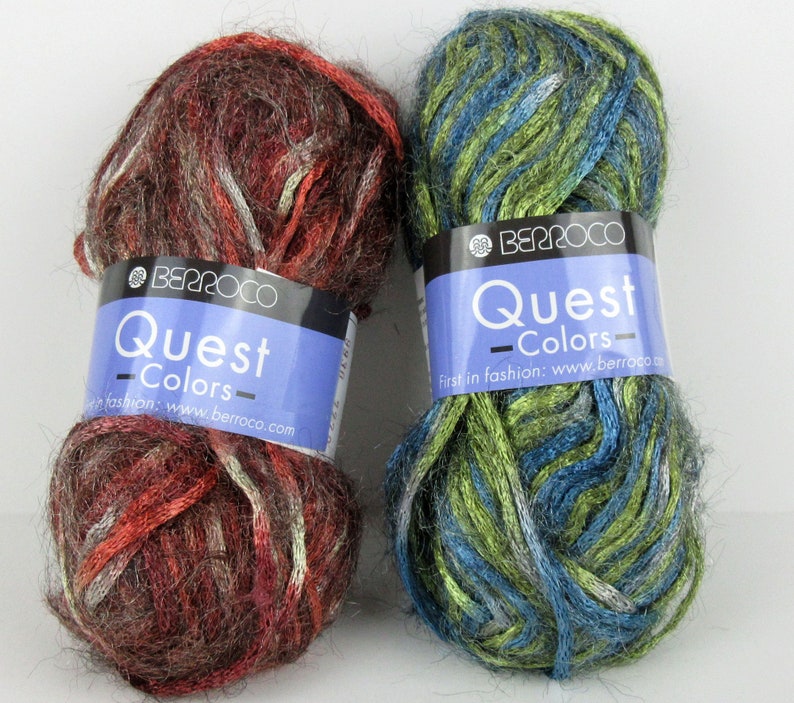 May include: Two skeins of yarn in the Berroco Quest Colors line. One skein is a mix of brown, red, and white, and the other is a mix of green, blue, and silver.