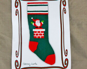 May include: A Christmas stocking with a green body, red heel and toe, and a white and green striped cuff. The stocking features a Santa Claus design emerging from a red brick chimney. The words "Chimney Santa" are printed below the stocking.