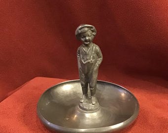 Pewter trinket dish, National Silver Co figural ring tray. Small metal bowl with boy to organize the dressing table. Ring storage.