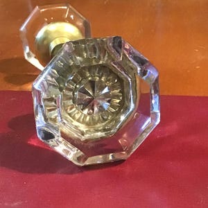 Vintage door knob set in glass snowflake design, faceted glass doorknob set. Eight sided with polished brass bases, set screws and shaft.