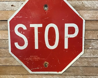 Faded mini stop sign, vintage 12 inch octagon, red and white, retired decommissioned reflecting traffic control sign,