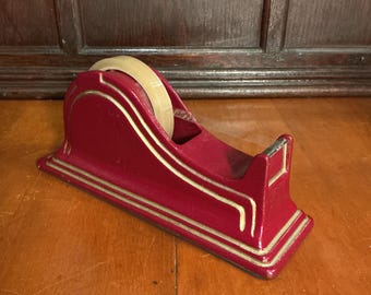 Red Texcel metal tape dispenser, 10 inch, sleek curvy body, classic design for large diameter tape roils. All metal body for one hand use.