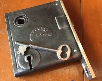Vintage Norwalk brass face mortise lock with key.  Cleaned lubricated moves smoothly. Restoration hardware replacement.