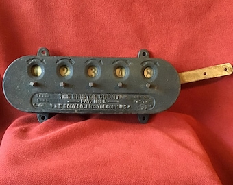 Vintage cycle counter by Bristol. 5 digit consecutive count by the Root Co. Metal case with removable back cover, reset twist stems.