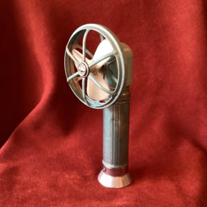 Tin litho toy fan, working battery personal fan. Open cage design 50s era all metal toy. 2 tone blue in good condition.