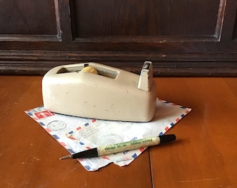 MCM metal tape dispenser, sleek body, classic design an office ‘staple’. All metal body for one hand use.