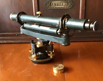 Buff and Buff Transit, wood case, large telescope, brass mining and land measurement tool. Turned brass lens cap. 25910