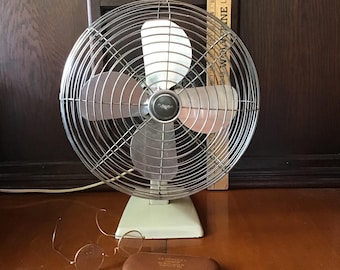 Manning Bowman fan, oscillating single speed MCM era fan made in USA. All metal fan in good working condition. Tilting head powerful.