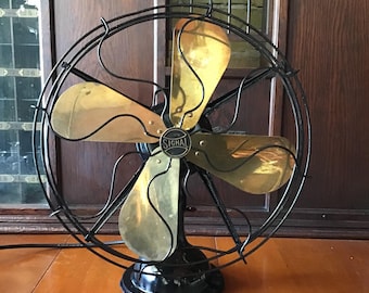 Vintage Signal Oscillating Fan: 17-inch, 3-Speed, Open Cage Design. Brass 4 blade fan, cast metal base. Large heavy duty fan.