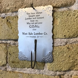 Vintage Advertising Wall Hung bill hook. West Side Lumber Co. Vintage Americana coal and cement sales, pressed aluminum, 2 digit phone no.