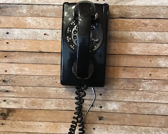 Converted dial wall phone, black rectangular vintage phone with adjustable ringer volume. Classic design updated to the modern pulse system.