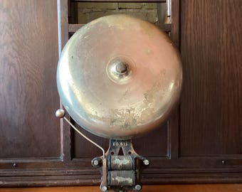 Fire alarm, large 12 inch wide 12 volt brass bell, loud classic ring tone. Cast metal frame, side clapper, worn chrome finish.