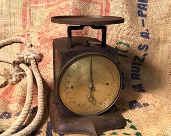 Brass face scale by Universal Family Scale Co. Pat date 1865 scale measures in pounds and scales 0 to 22 lbs. Adjustable vintage scale.