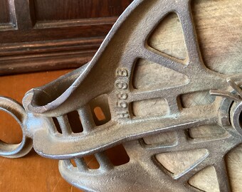 Squirrel cage pulley, wood wheel and cast iron barn pulley. Large metal and wood, used with rope for hoisting, lifting, moving, farm work.