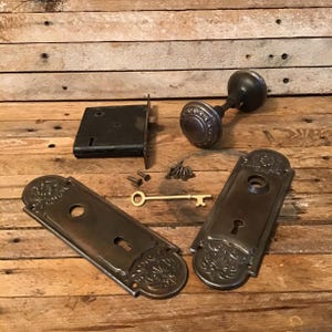 Vintage mortise lock with skeleton key door knob set and face plates. Working lock set, cleaned lubricated moves smoothly. All metal parts.