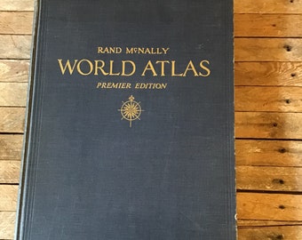 Rand McNally World Atlas in good vintage condition 1949 edition with full color maps and articles