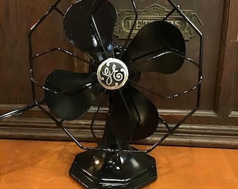 GE "Gramophone" horn style base single speed black desk fan Cat 49X718 ,open cage design. Lubricated cleaned and ready for a new life.