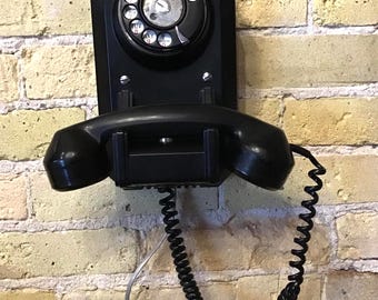 Updated dial wall phone, Black shiny finish American Electric Co. Works with modern systems. Very good condition. Classic ring tone.