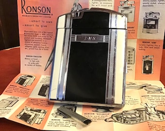 Cigarette lighter and case by  Ronson, classic Art Deco style enameled pocket size case. Machined metal interior.