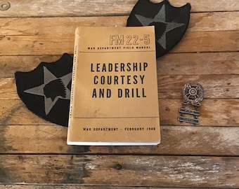 War Department Field Manual 1946 edition FM 22-5 in good vintage condition strong graphics, Leadership Courtesy and Drill.