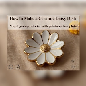 May include: A ceramic daisy dish with white petals and a gold centre and rim. The image includes the text "How to Make a Ceramic Daisy Dish" and "Step-by-step tutorial with printable template."