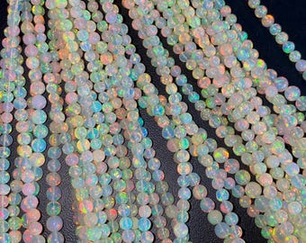 Bolas esféricas de ópalo etíope: hilo de bolas redondas de piedra preciosa de fuego blanco llamativo