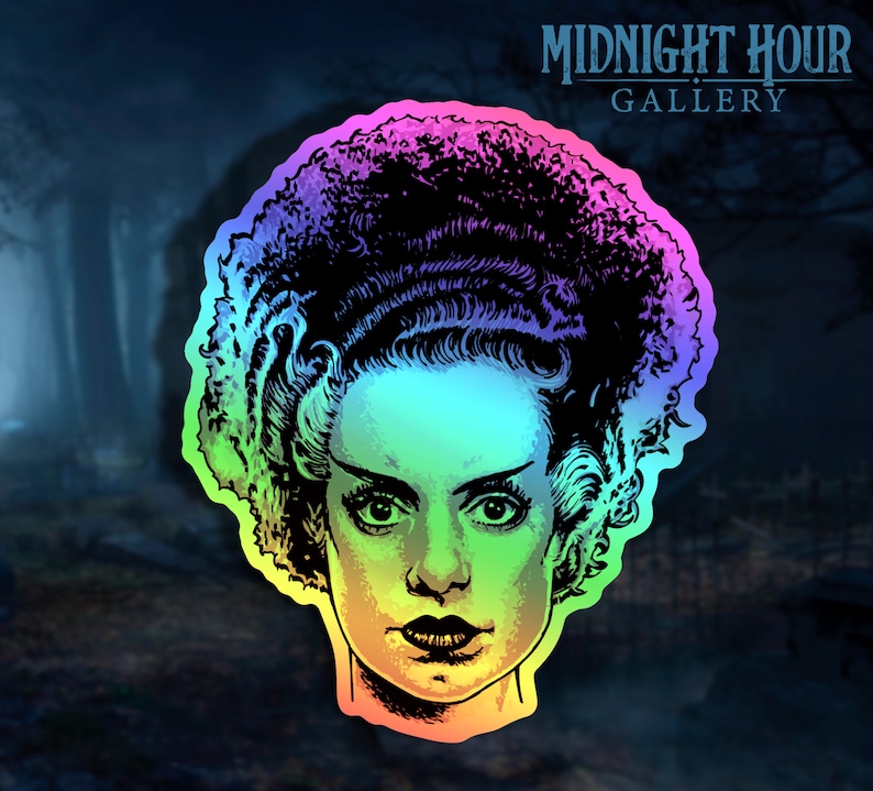 May include: A rainbow holographic sticker featuring a black and white illustration of the Bride of Frankenstein. The sticker has a black outline and a rainbow gradient background.