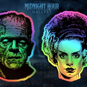 May include: Two iridescent stickers featuring the faces of Frankenstein's monster and his bride. The stickers have a rainbow holographic effect.
