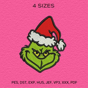 May include: An embroidered design of a green character wearing a red Santa hat with white trim. The character has a grumpy expression with yellow eyes. The text "4 SIZES" is above the character. The background is pink.
