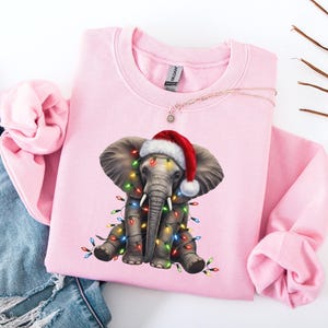 Cute Elephant Christmas Lights Sweatshirt, Santa Hat Elephant Tee, Holiday Animal T-Shirt, Festive Elephant Xmas Gift, Wildlife Christmas