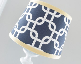 Small Navy Blue and white Gotcha lamp shade with accent yellow trim.