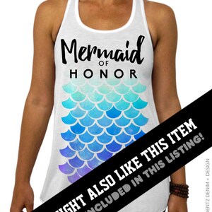 May include: White tank top with the text "Mermaid of Honor" in black script. Below the text is a mermaid scale design in shades of blue and purple. A fun top for a bachelorette party or bridal event.