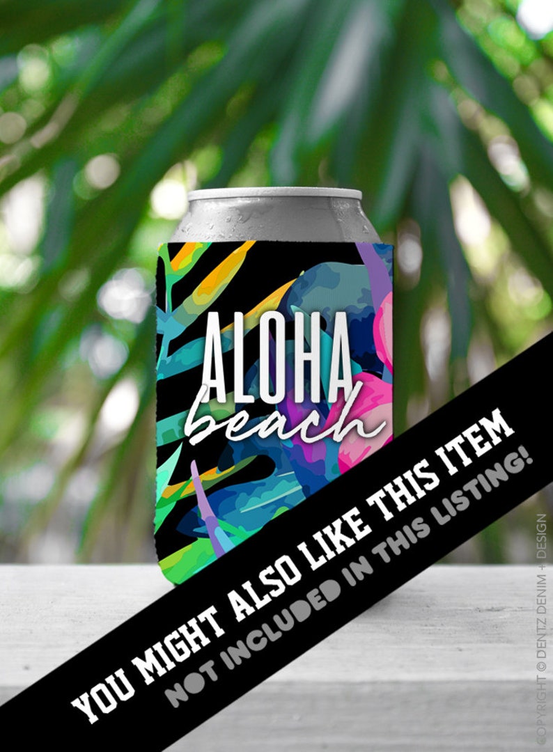 May include: A black and white can cooler with a tropical floral design and the text "ALOHA beach". The cooler is on a white surface with a black and white sign that says "YOU MIGHT ALSO LIKE THIS ITEM NOT INCLUDED IN THIS LISTING!"
