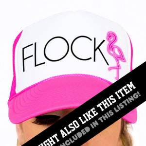May include: White trucker hat with a pink brim and a black mesh back. The front of the hat has the word "FLOCK" in black text and a pink neon flamingo graphic.