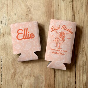 Personalized Last Rodeo bachelorette can cozies featuring a Western-themed design with a paisley background and a cowgirl in a martini glass. Customizable with names, event details, and available in multiple colors. Designed for slim and standard 12oz cans, these insulated drink holders are perfect for bachelorette parties, birthdays, and country music festivals.