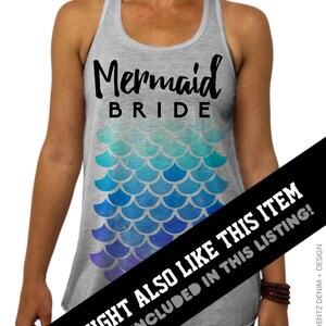 May include: A gray tank top with the words "Mermaid BRIDE" in black script. Below the text is a mermaid scale design in shades of blue and purple. The tank top is a bridal themed item.
