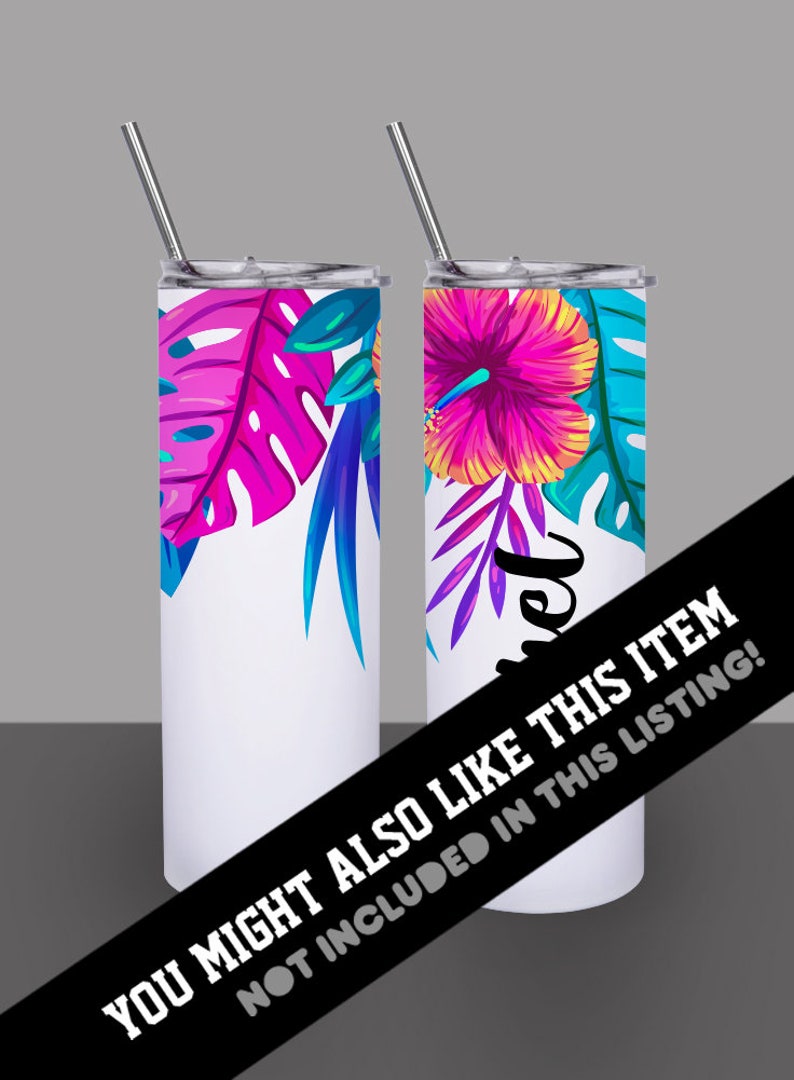 May include: Two stainless steel tumblers with lids and straws. One tumbler features a pink and blue tropical leaf design. The other tumbler features a pink hibiscus flower with yellow accents and blue tropical leaves. Both tumblers have a white background.
